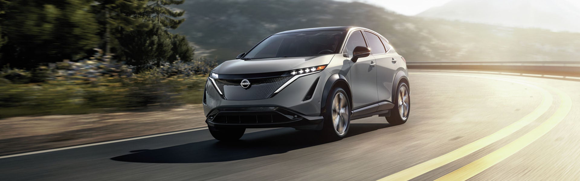 Ariya Vehicle Moving On A Road Passing Through The Hills